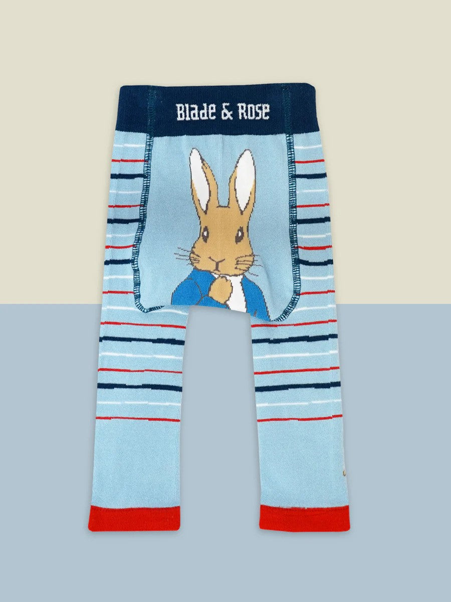 Blue leggings with white and red stripes and a Peter Rabbit design on the bottom