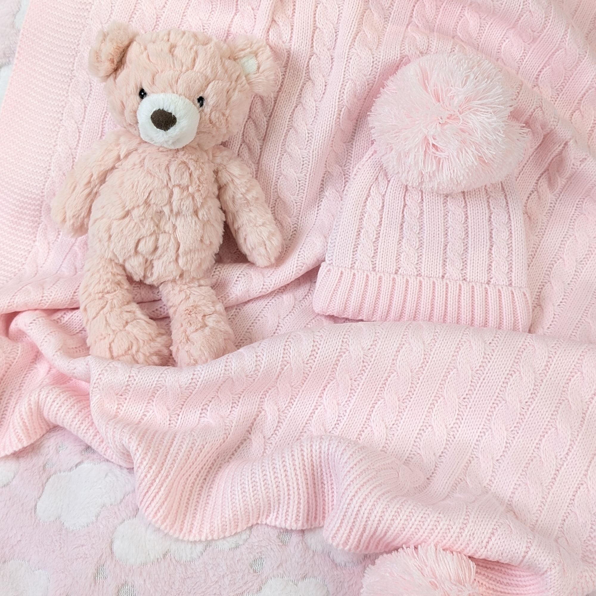 Pale pink knit baby blanket and Pom Pom hat set