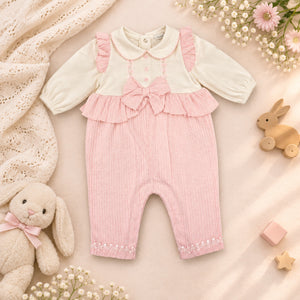 Pink baby girl romper with lace appliqué and bow detail