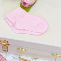 Pink baby socks with a turnover. Soft cotton.