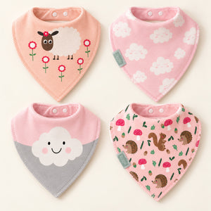 Four pink bandana bibs laid flat with sheep, white clouds, a smiling cloud and woodland animal designs.