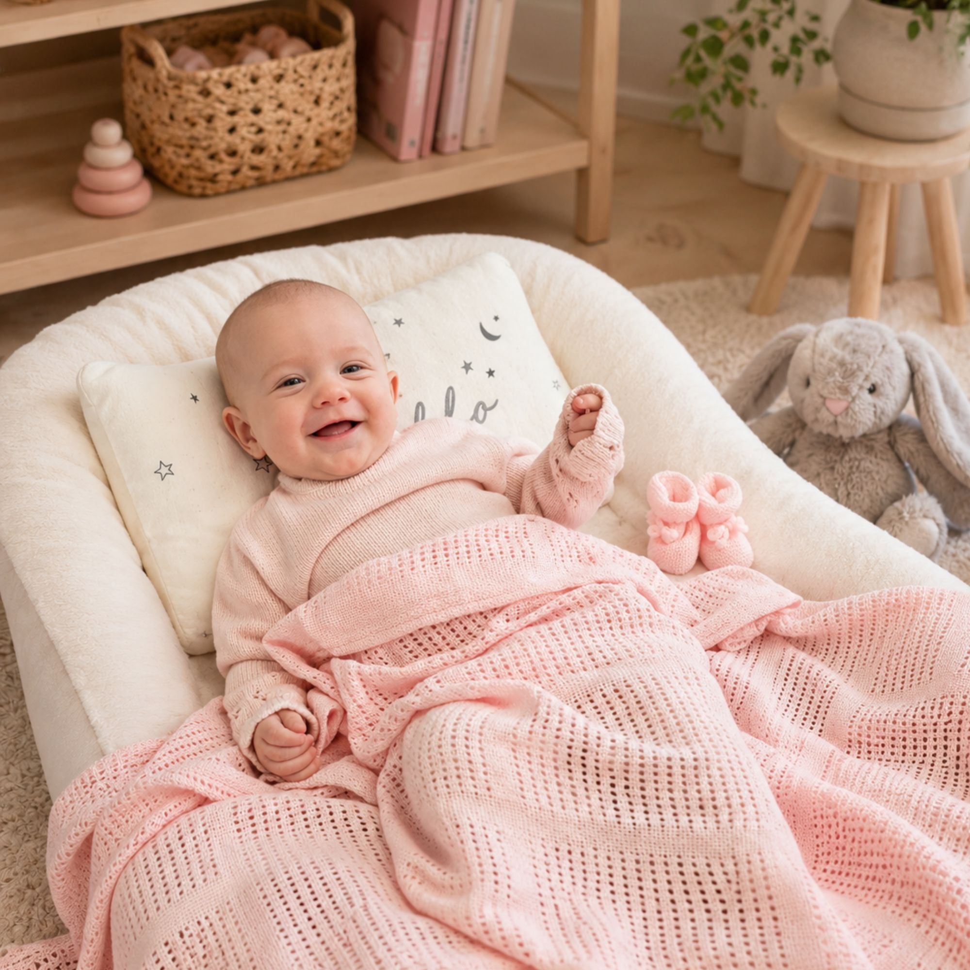 A pink cotton cellular baby blanket