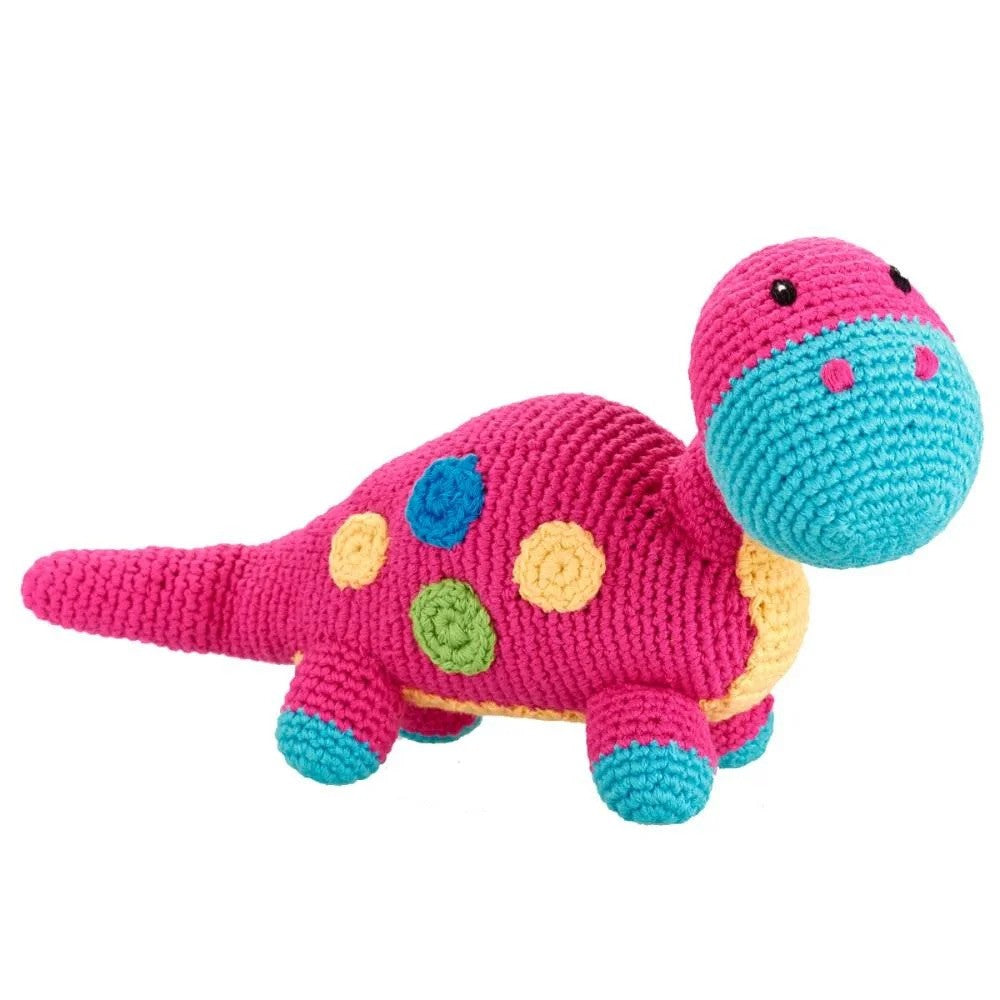 Crochet pink dinosaur toy with blue, yellow and green accents