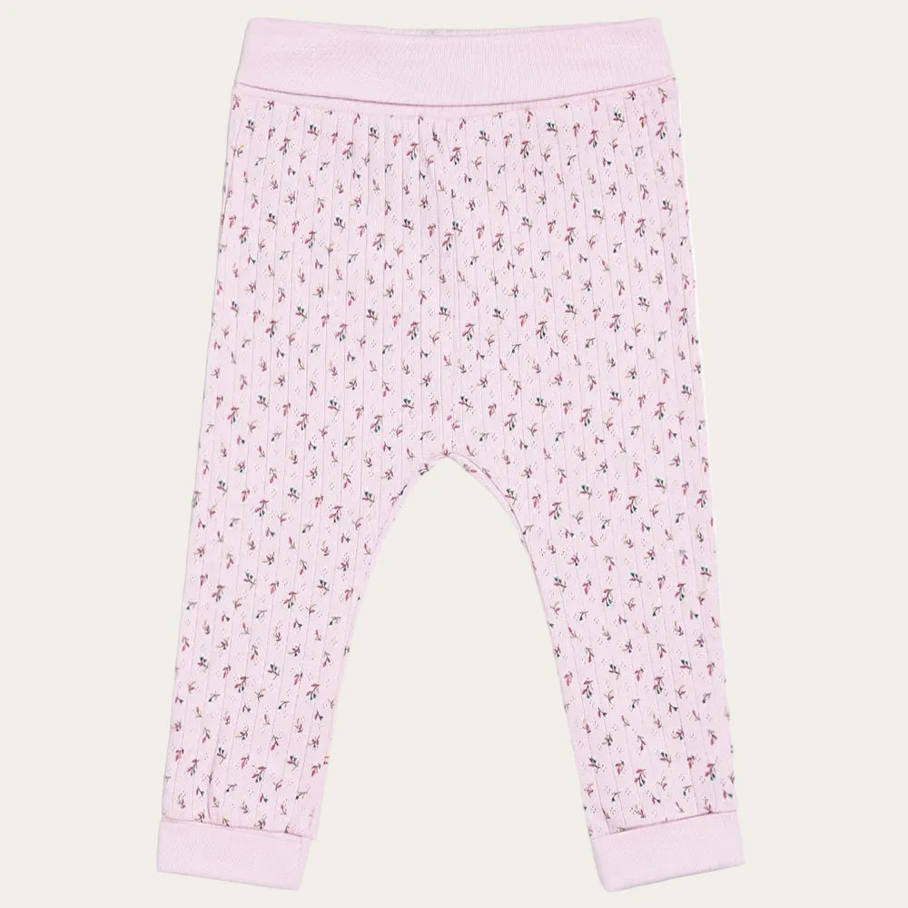 Pink baby leggings with a subtle pattern on a white background