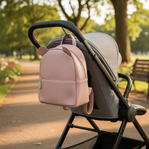 Pink children's backpack with curved top zip fastening and ears designed by Katie Loxton