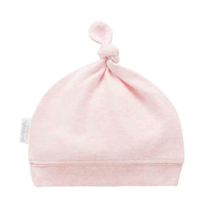 Pink organic cotton baby knot hat with soft ribbed band and adjustable top knot designed for comfortable newborn baby clothes.