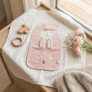 Pink Mrs Rabbit baby bib with long ears and embroidered rabbit face