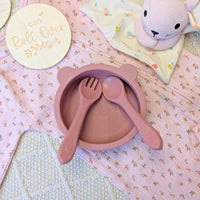 Pink silicone baby bowl with suction base and matching fork and spoon