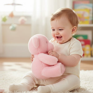 Soft pink teddy bear plush toy 25cm made from recycled materials with embroidered eyes and gentle baby-safe finish