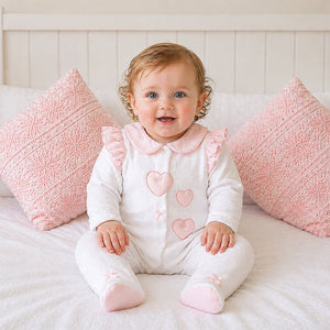 Pink and white Cuddle Me baby girl all-in-one with bow detail