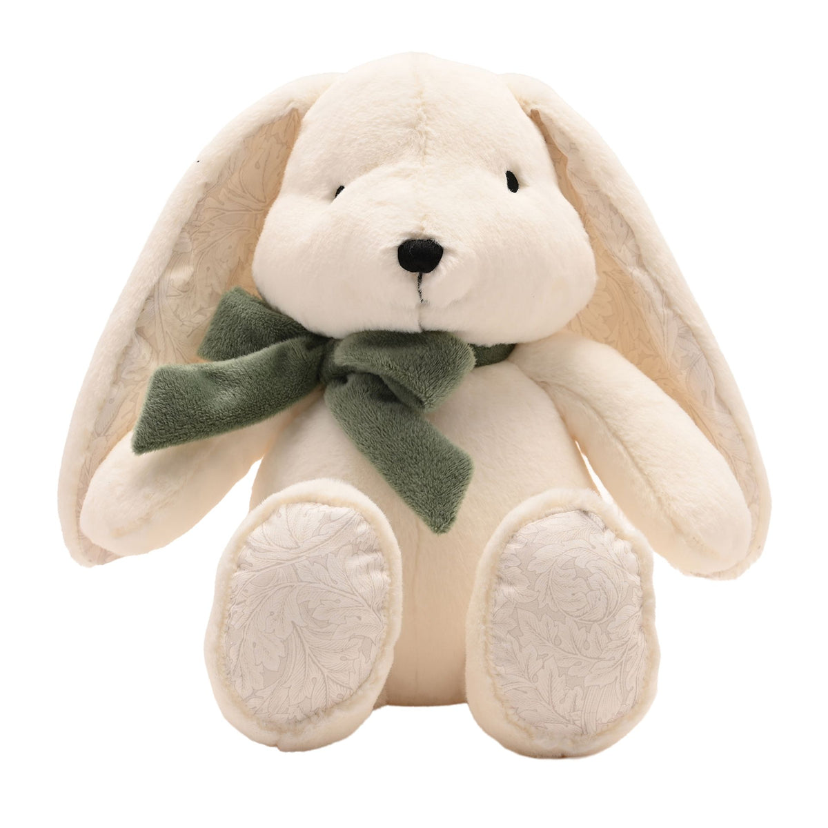 Front view of cream bunny showing floppy ears and patterned paw pads