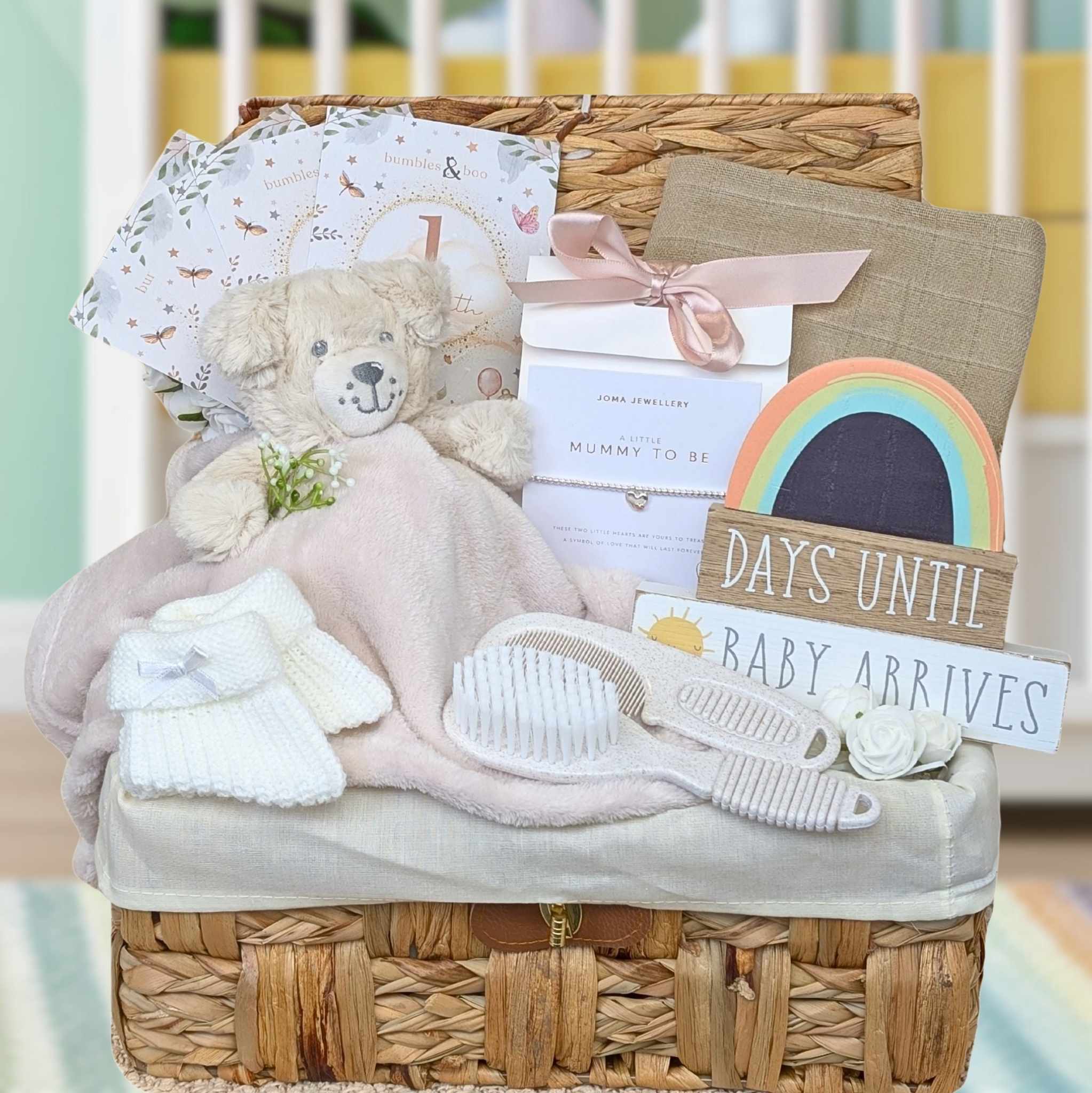 Pregnancy gift basket with nursery plaque and teddy bear comforter. 