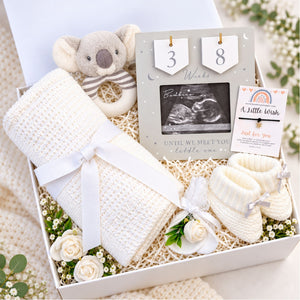 Pregnancy hamper gift box with a countdown frame and mum to be gifts by Bumbles and Boo.