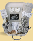 Pregnancy gifts in a hamper with countdown frame.