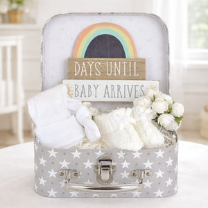 Pregnancy gifts in a luggage suitcase hamper with days until baby arrives nursery plaque