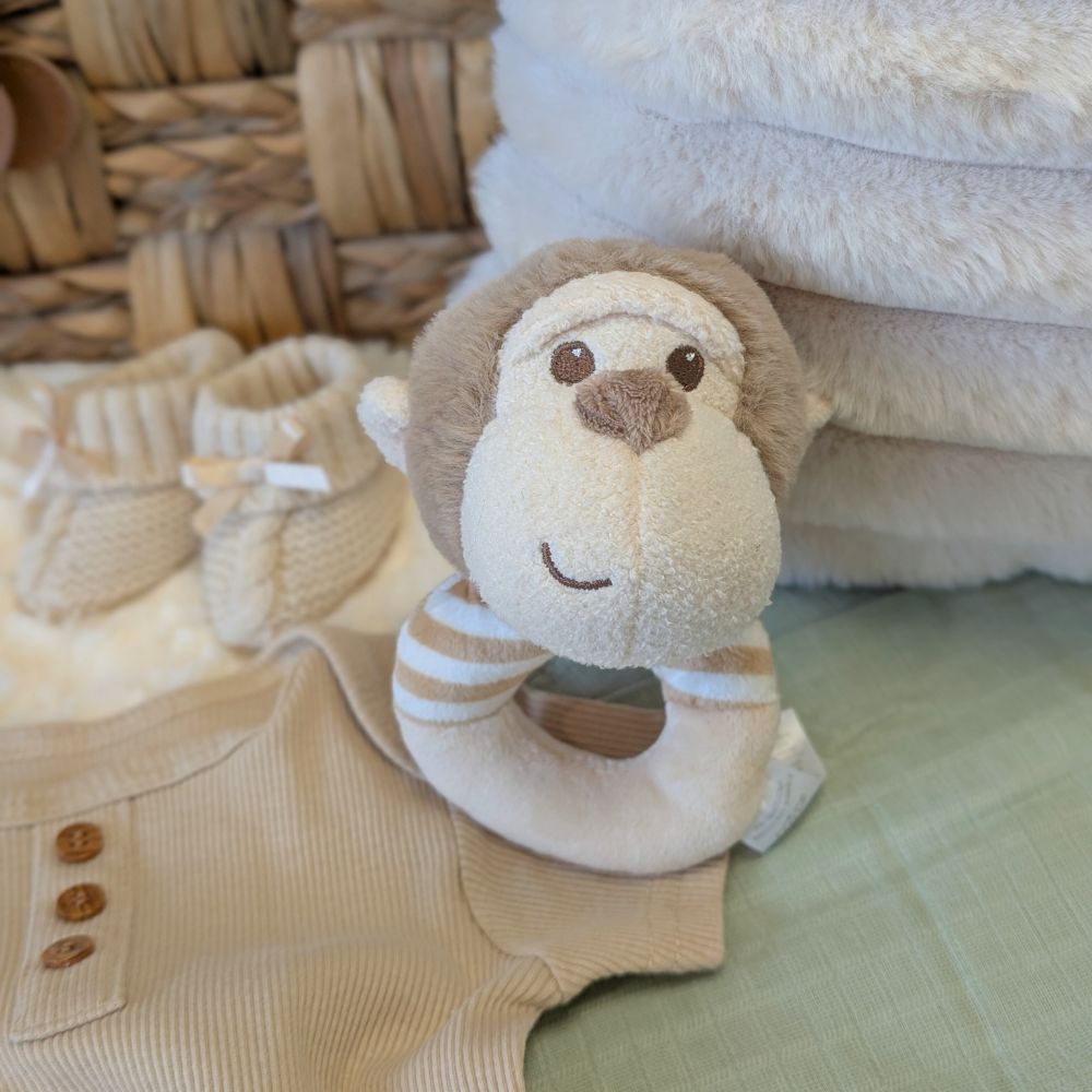Plush monkey soft toy rattle.