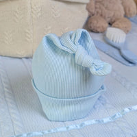 Light blue baby cotton hat made from recycled materials.