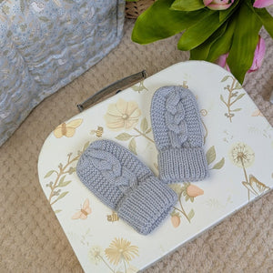 Pair of grey knit baby mittens made from recycled materials.