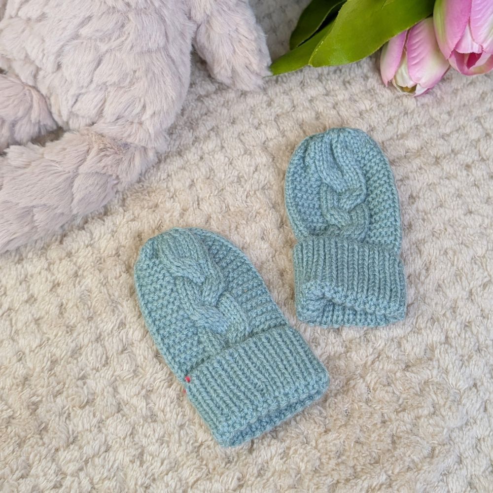 Pair of sage green knit baby mittens in recycled knit material