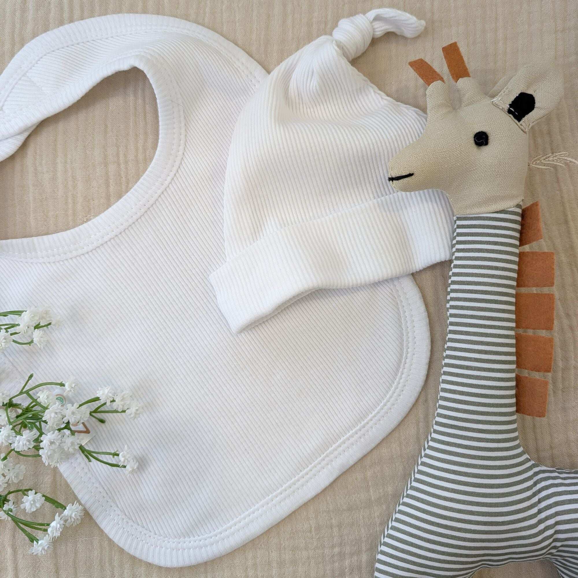 White baby hat & bib set made from recycled cotton
