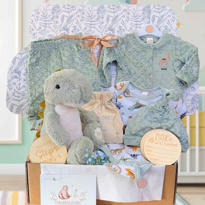 Baby boy gift box with dinosaur soft toy and sage green clothing in a hamper box.