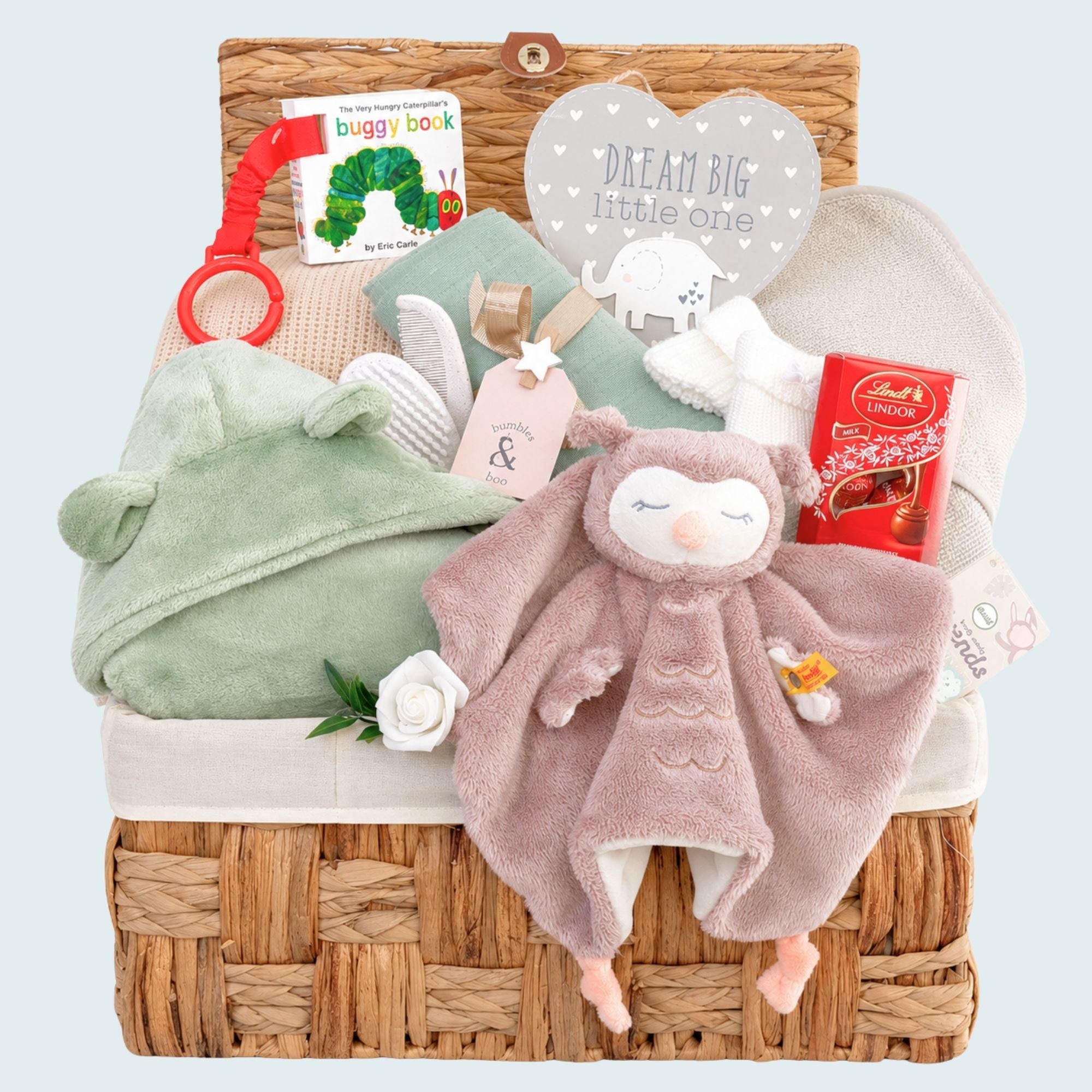 Baby gifts in a hamper with Steiff owl comforter and essential new baby gifts – perfect for a thoughtful present.