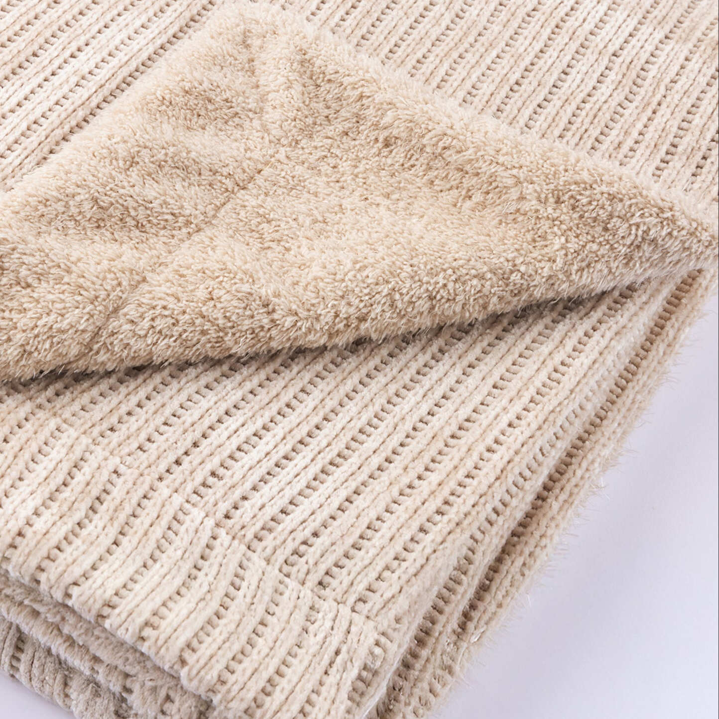 Blanket with folder corner to show sherpa lining