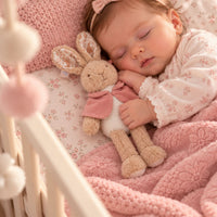 Flopsy bunny soft toy for a baby girl with a velvet dusky pink jacket