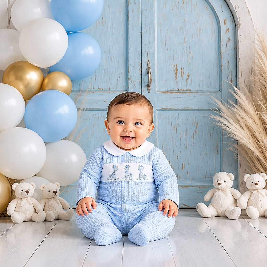 Sky blue giraffe smocked baby boys all-in-one