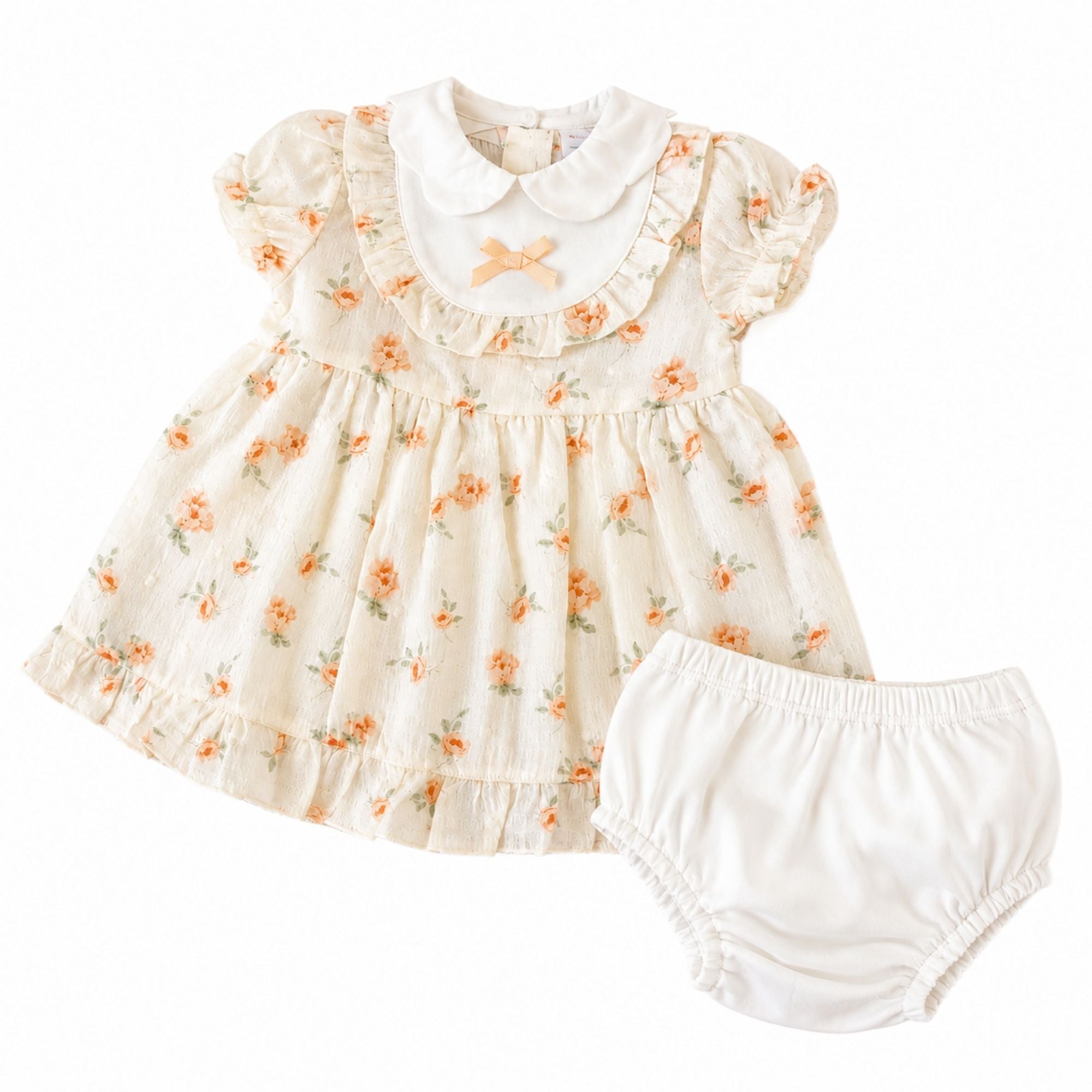 Baby girl clothing outfit of a dress and under pants.  In Beige with a floral pattern
