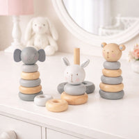 Baby wooden stacking toys in white, grey and brown with elephant, bunny and bear.