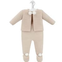 Taupe knitted jacket and footed leggings displayed on a hanger, with ivory pom poms at the neckline and ankles.