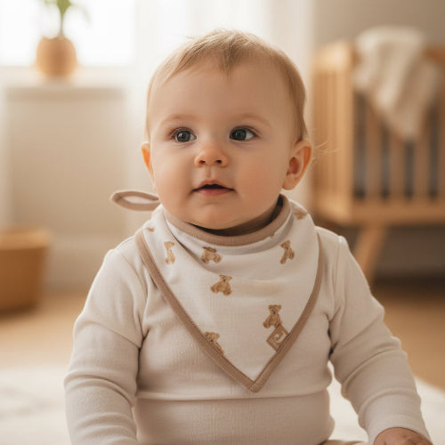 Bandana teddy bear print baby bib. Traditional style in cream and beige for dribbles and baby feeding. 