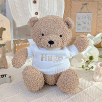 Teddy bear wearing a white personalised sweater.