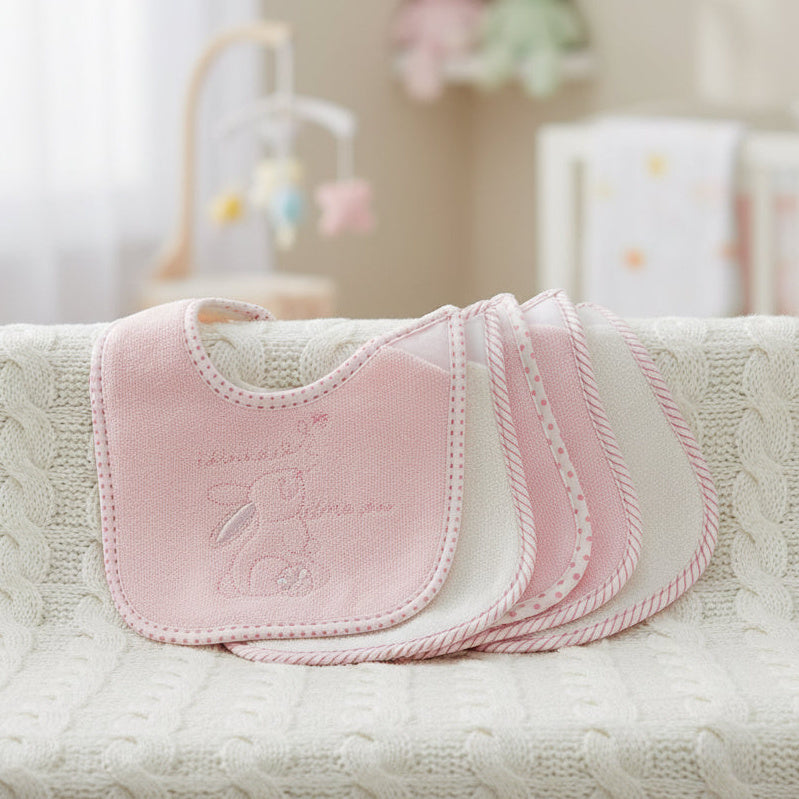 Set of 5 terry cloth baby bibs with 3 pink and 2 white with a bunny motif