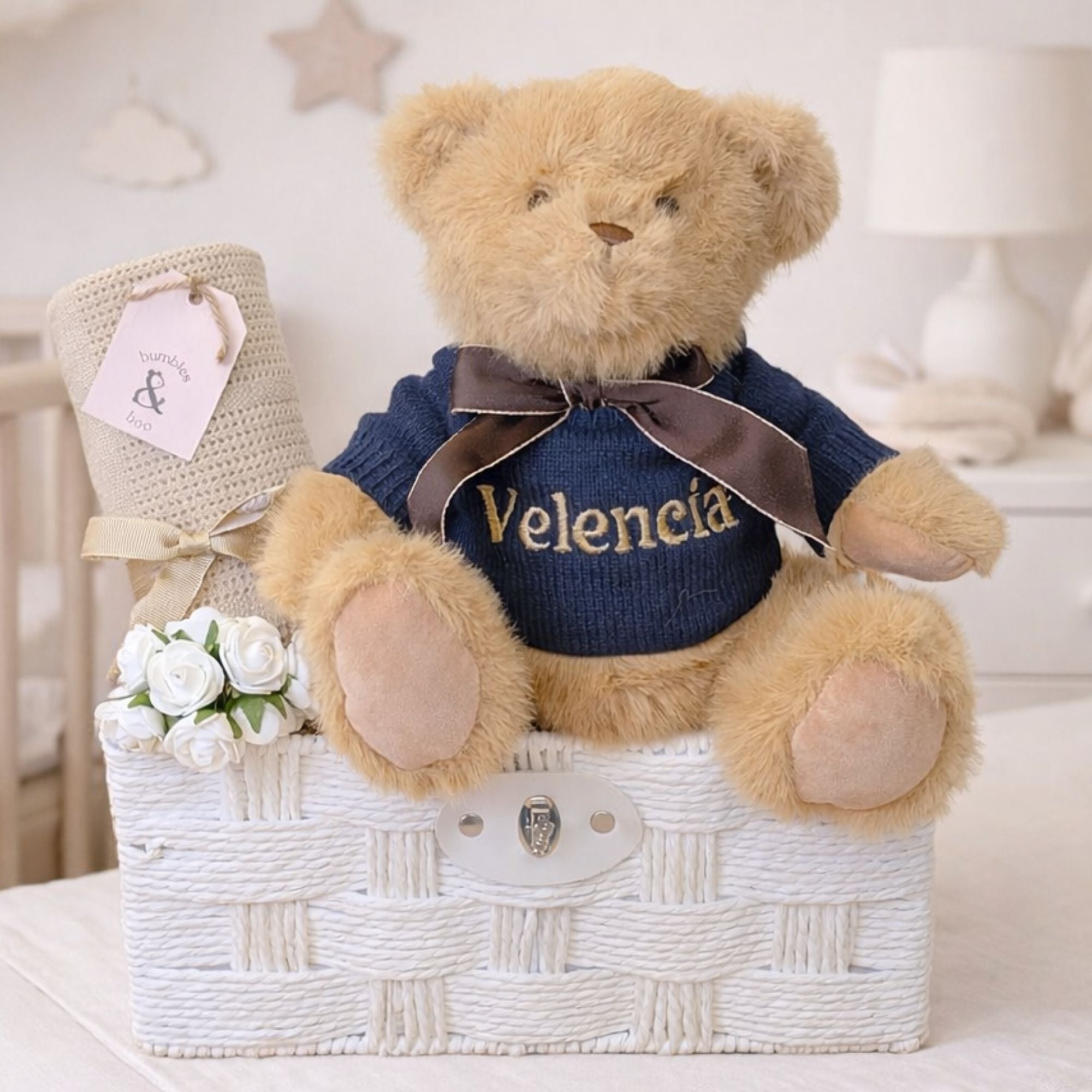 Teddy bear hamper gift for a baby with a cellular baby blanket and teddy in an embroidered blanket.