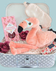 Treat trunk filled with flamingo sweets, flamingo soft toy, eye mask, hand cream and soap roses.