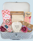 Pamper treat trunk filled with adorable treats for a special friend. Sent a hug in the post with these pamper gifts. Trinket tray, sweets, soap roses, lip balm, tea bags and more.