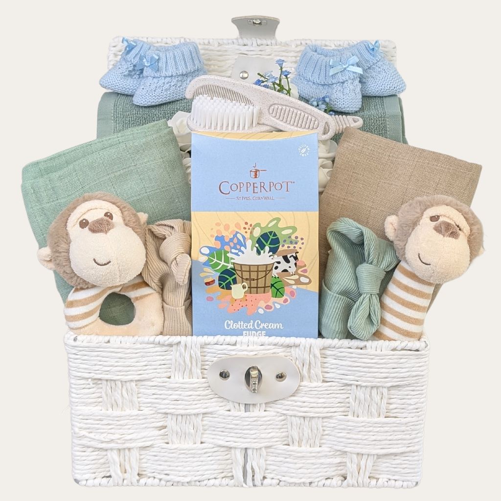 Gifts Hamper for twin boys with a monkey theme with green, beige and blue tones. Filled with essential presents. Bumbles and Boo. 