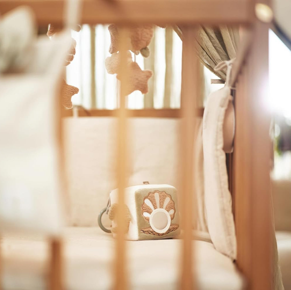 Soft cube toy featuring whale, starfish, and turtle