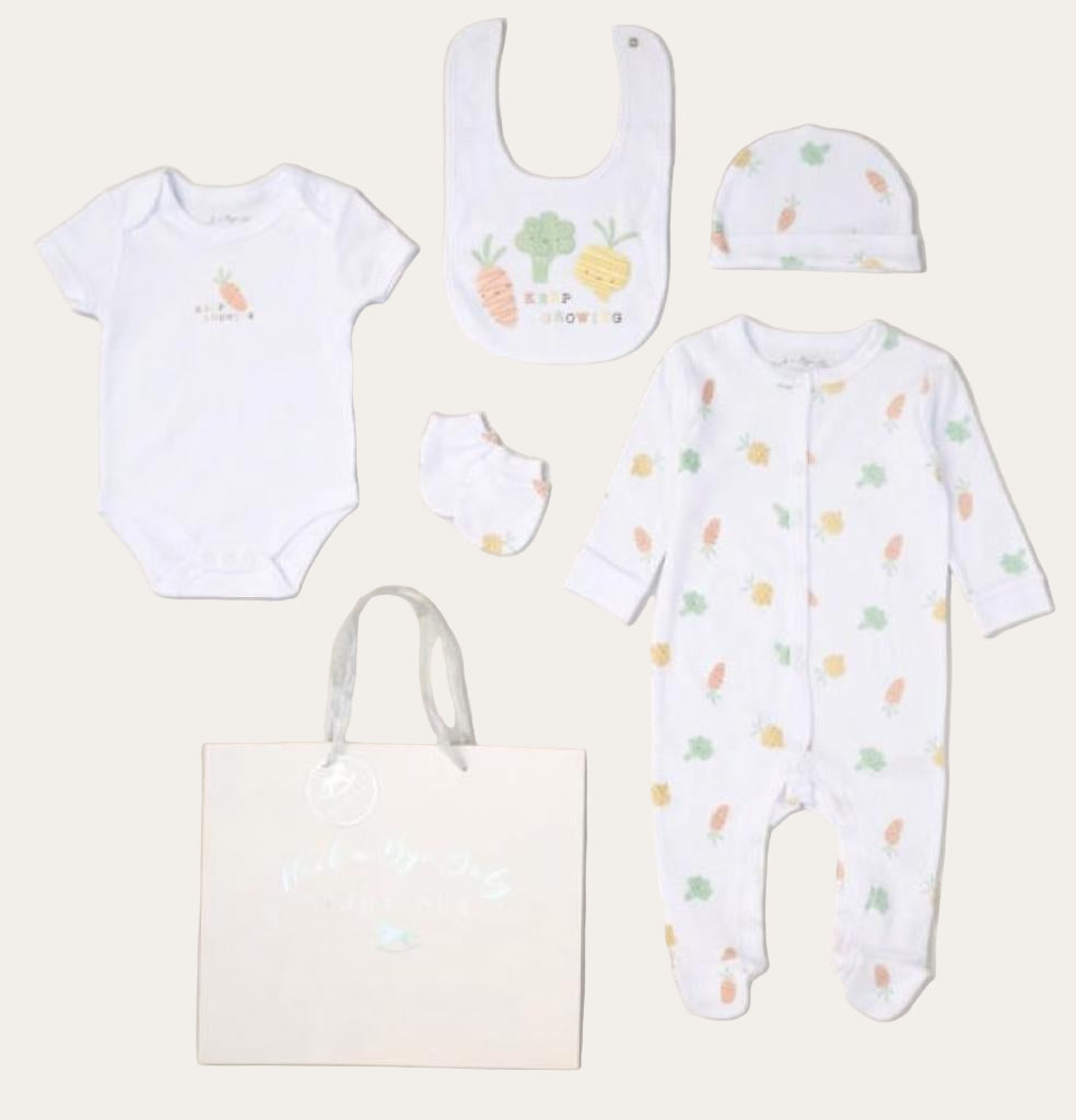 White unisex baby clothing set with newborn essentials