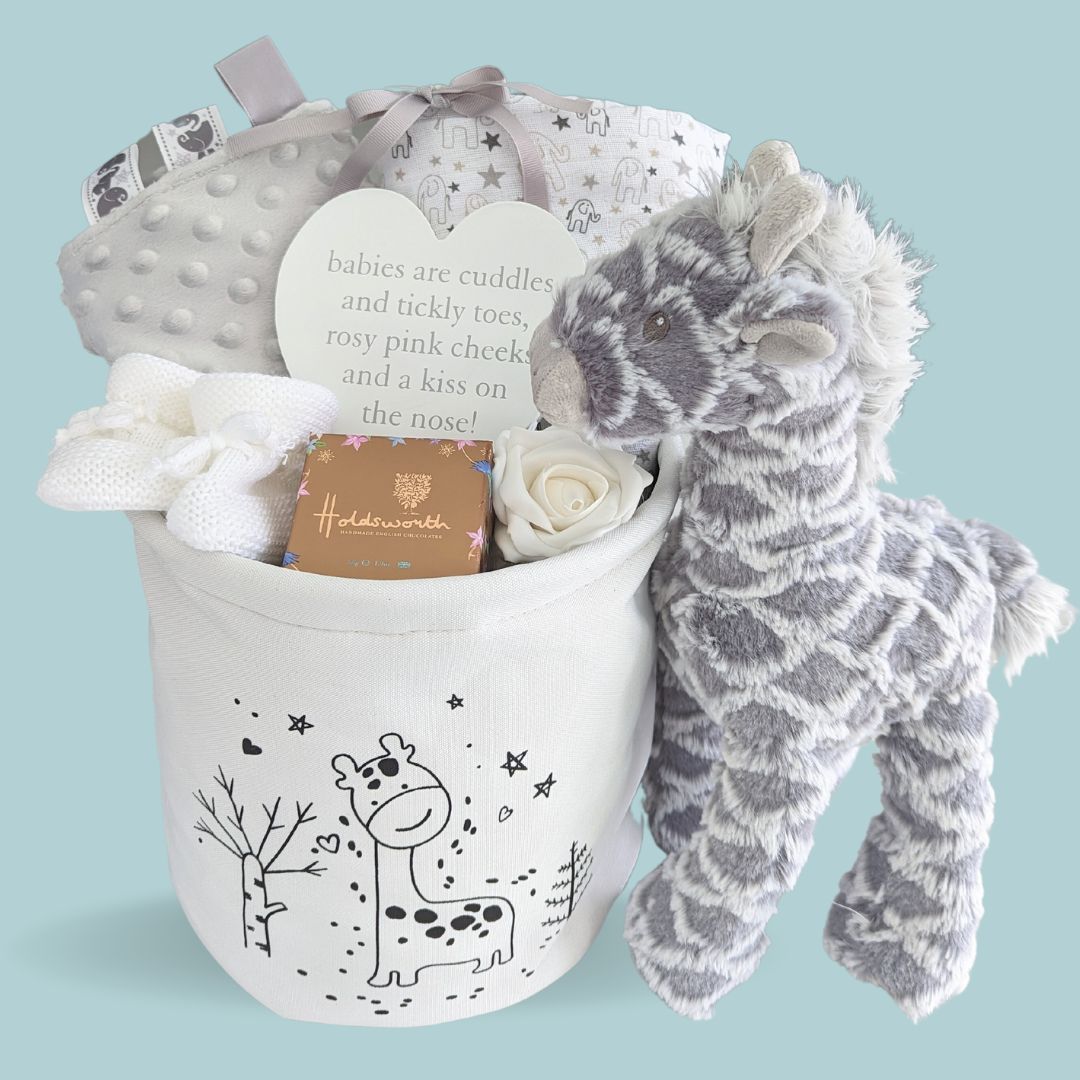 This award winning baby gift hamper is not only beautiful but also extremely useful. It contains a baby blanket, giraffe soft toy, baby booties, muslin wrap and chocolates.