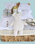 unisex baby hamper with teddy bear, baby clothing, baby booties, organic baby wash, bath robe and silver keepsake. 