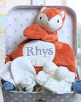 Fox themed baby hamper with baby scratch mittens and white knit baby booties.