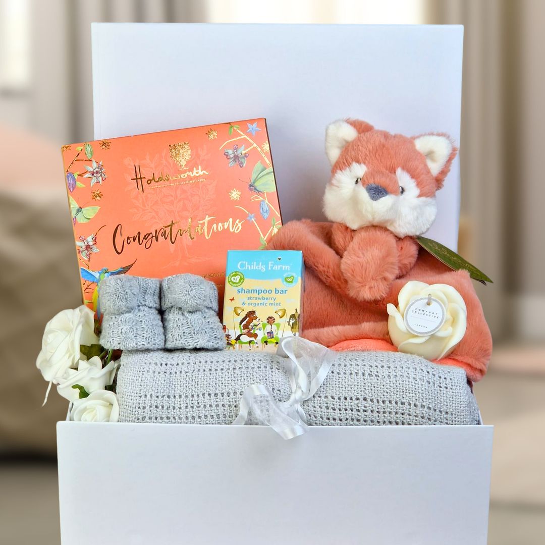 unisex baby hamper gifts with fox theme.