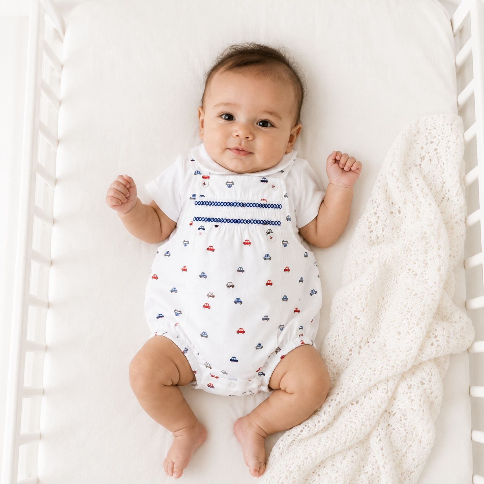 Baby romper with car pattern in white, red and blue