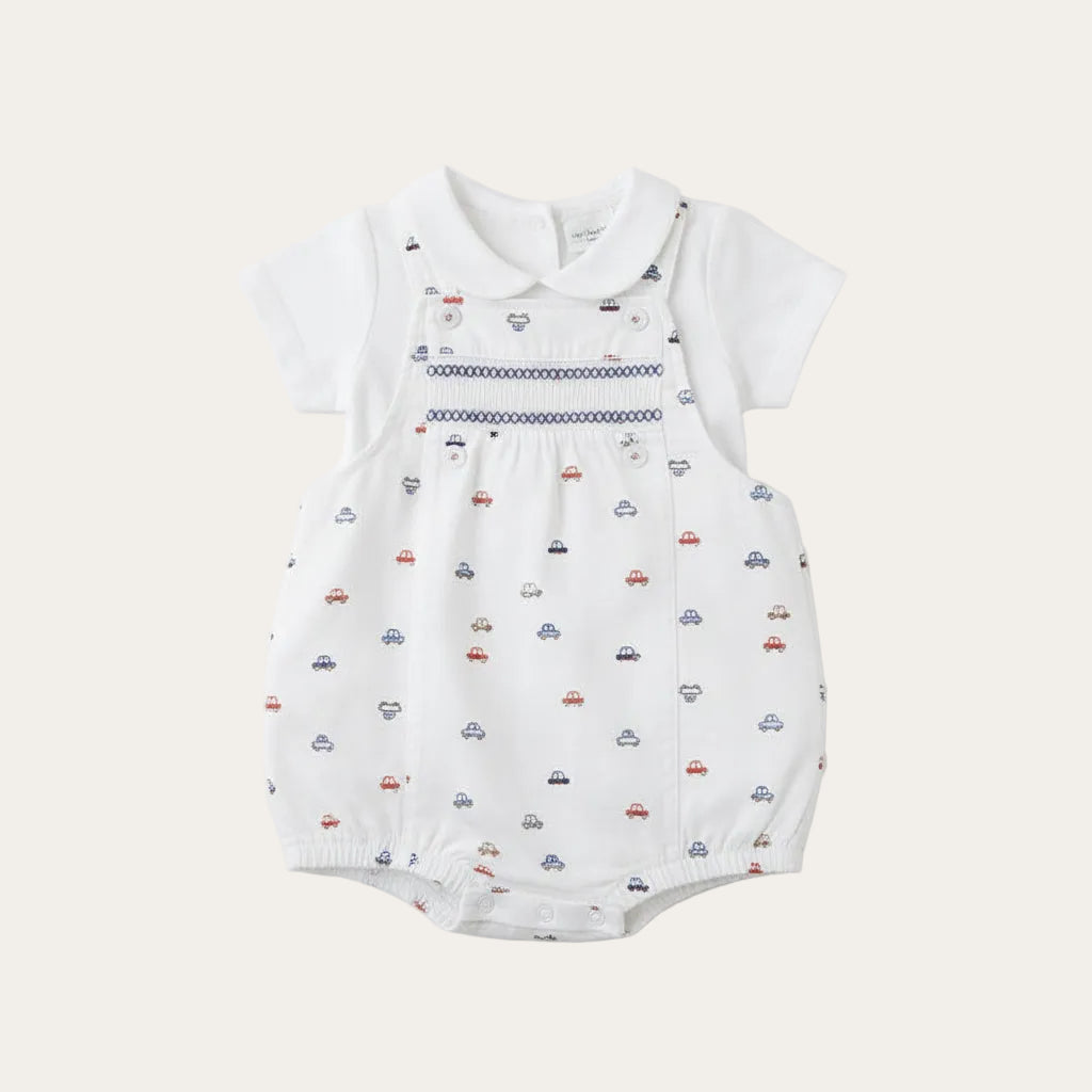 A white dungaree and top set with vehicle print
