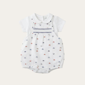 A white dungaree and top set with vehicle print
