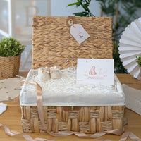 Hamper basket for baby gifts made from water hyacinth.