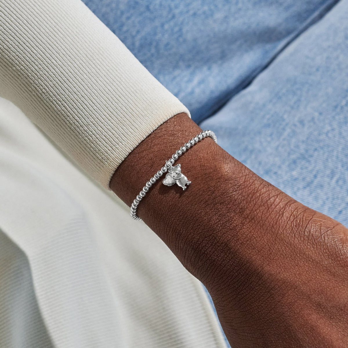 Silver plated beaded Welcome To The World bracelet detail